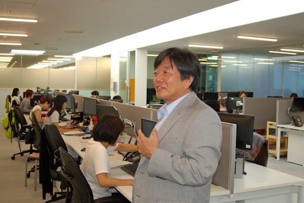 シティグループ沖縄オペレーションセンターでサイトマネージャーを務める岸本稔彦さん。